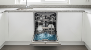 Dishwasher not draining with standing water pooled at the bottom of an open dishwasher in a modern kitchen